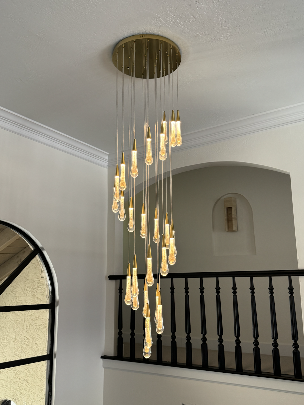 Custom chandelier over a stair landing